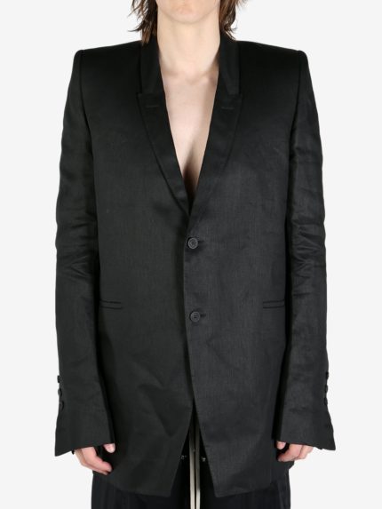 Black coat worn by a person, showing the coat's fit