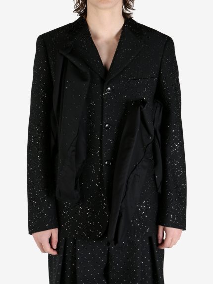 Black jacket worn by a person, showing the jacket's fit