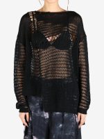 Black top worn by a person, showing the top's fit