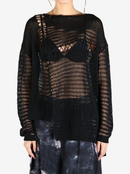 Black top worn by a person, showing the top's fit