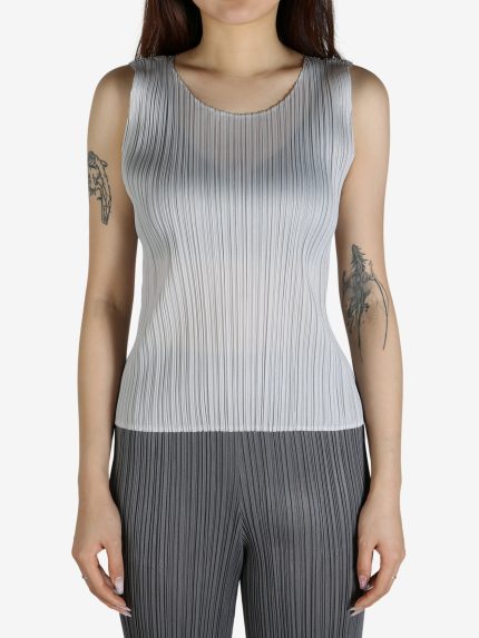 Grey shirt worn by a person, showing the shirt's fit