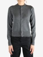 Grey knitwear worn by a person, showing the knitwear's fit