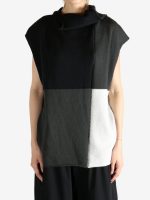 Black top worn by a person, showing the top fit