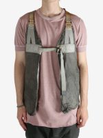 Grey vest worn by a person, showing the vest fit