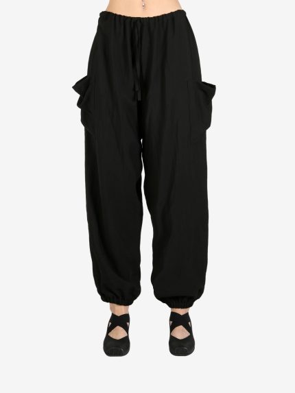 Black pant worn by a person, showing the pant's fit