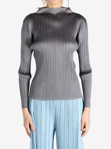 Grey shirt worn by a person, showing the shirt's fit
