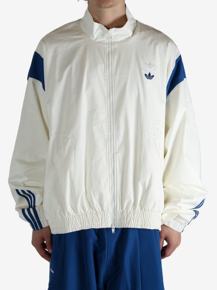 White jacket worn by a person, showing the jacket's fit
