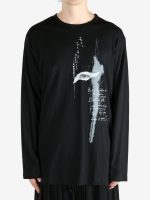 Black t-shirt worn by a person, showing the shirt's fit