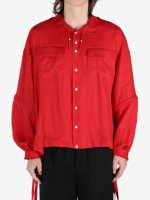 Red shirt worn by a person, showing the shirt's fit