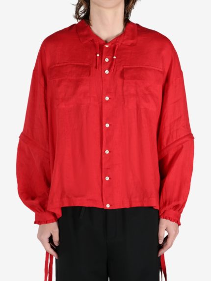 Red shirt worn by a person, showing the shirt's fit
