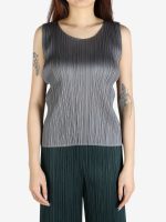 Grey shirt worn by a person, showing the shirt's fit
