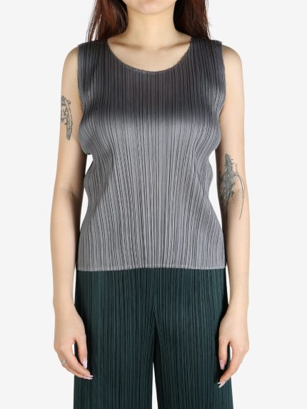 Grey shirt worn by a person, showing the shirt's fit
