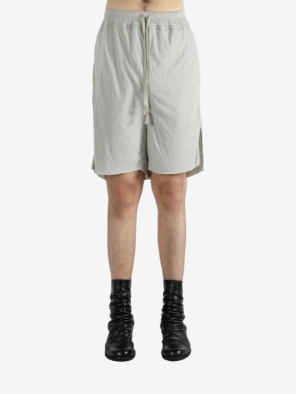 White shorts worn by a person, showing the shorts's fit