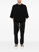 Black t-shirt worn by a person, showing the t-shirt's fit