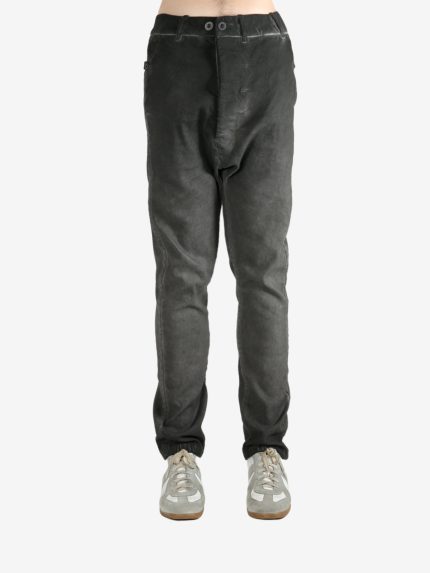 Grey pants worn by a person, showing the pants fit