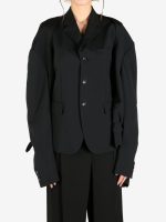 Black jacket worn by a person, showing the jacket's fit